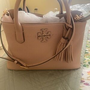 Tory Burch tote about 10”H x 14W x 5.5 D. Pristine inside and out.